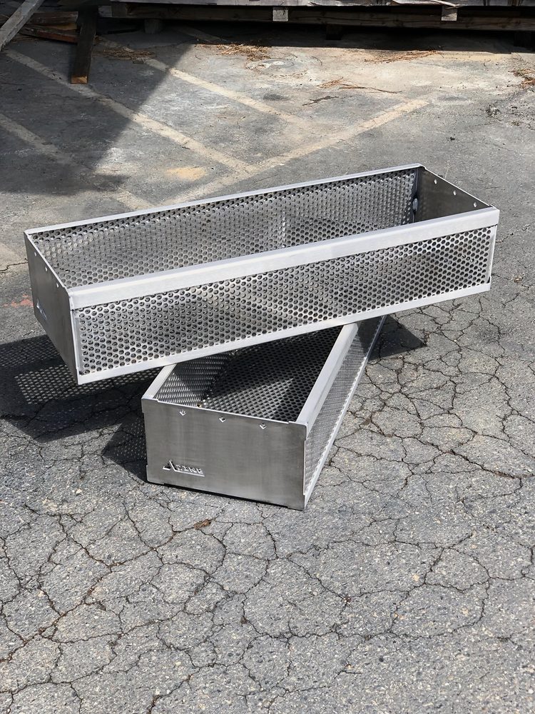 Two perforated stainless steel trays