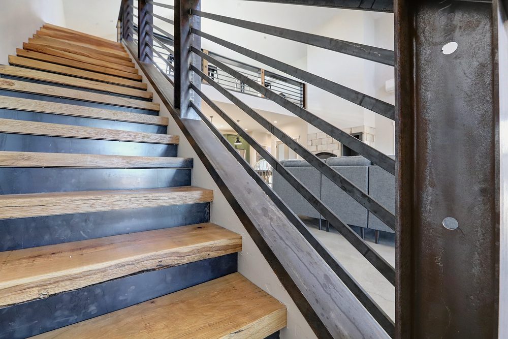 Close up of blackened steel stair rails, posts and risers