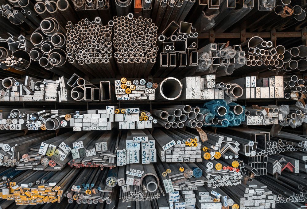 Rack of round, square and rectangular tube, angle, flat bar and round bar with size tags
